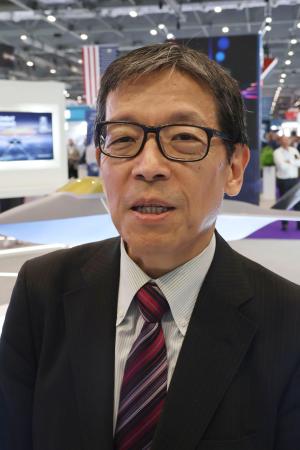 次期戦闘機開発について話すGIGOトップの岡真臣氏=9日、ロンドン(共同)
