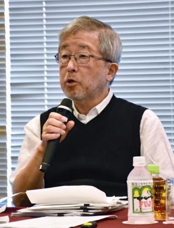 日本記者クラブで開いたシンポジウムで発言する飯村豊さん＝１４日午後、東京千代田区