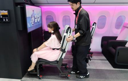 トヨタ紡織が出展した航空機内向けの車いす=29日、東京都江東区の東京ビッグサイト