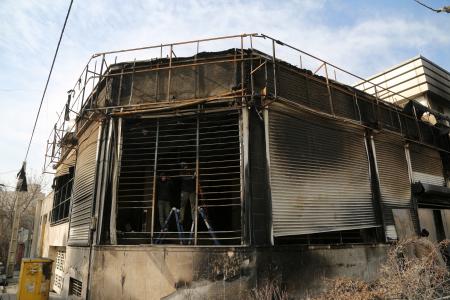 ２１日、イラン・テヘランで損傷した建物（ゲッティ＝共同）