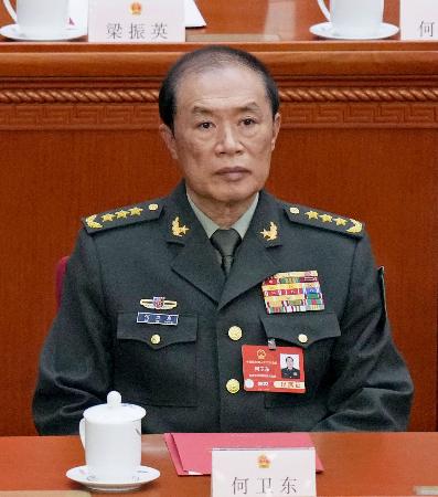２０２５年３月、中国全人代の閉幕式に出席した何衛東・中央軍事委員会副主席＝北京の人民大会堂（共同）